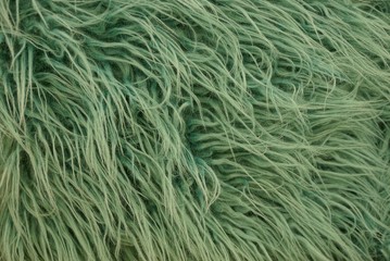 green texture of long wool fabric on clothes