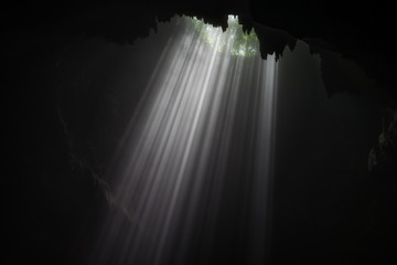 Illuminated cave at Goa Jomblang Tour near Yogyakarta, Indonesia