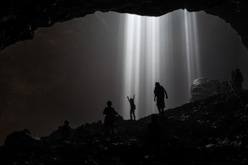 Illuminated cave at Goa Jomblang Tour near Yogyakarta, Indonesia - obrazy, fototapety, plakaty