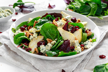 Fresh Pears, Blue Cheese salad with vegetable green mix, walnuts, cranberry. healthy food