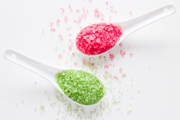 spa bath salt green and red on a white background