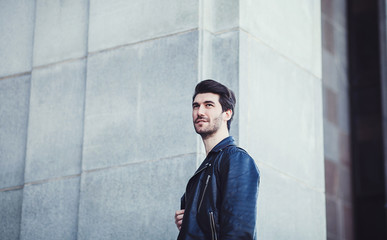 Photo of handsome man in black leather jacket