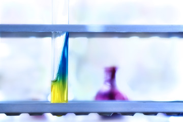 Test-tube with meat-peptone agar on blue background. Microbiological research