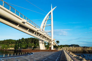Bridge at Seogwipo linking Seaseom and Seogwipo port in Jeju Island, South Korea - obrazy, fototapety, plakaty