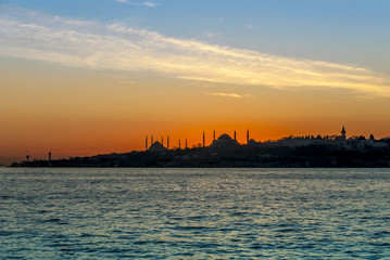 Fototapeta na wymiar Istanbul, Turkey, 23 January 2012: The Topkapi Palace and Hagia Sophia at sunset