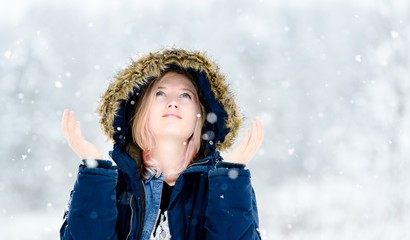 Young woman in snow with coat, Norwegian winter