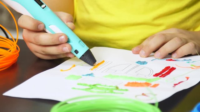 child draws helicopter with 3D pen
