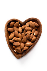 Almond in wooden bowl, isolated on white