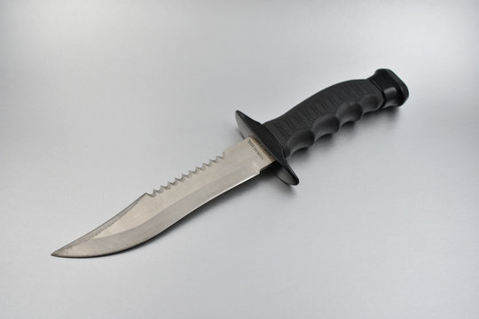 Hunting knife stock images. Stainless steel knife. Knife on a silver background. Survivor Hunting Knife