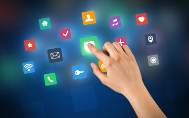 Female hand touching colorful applications 