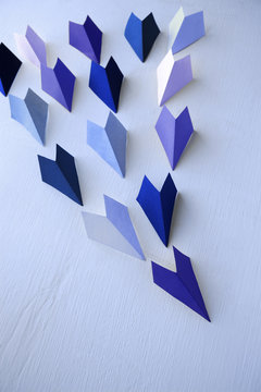 Origami paper sailboats, leadership business concept