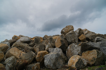 A ridge of rocks in the ocean.
