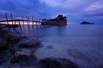 View from Agios Sostis and Cameo island with wooden bridge shot before sunrise . Zakynthos Greece.