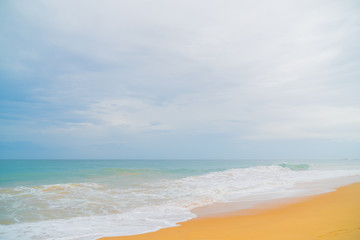 Foam wave, running on the sandy shore.