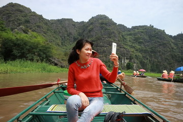 the woman traveling to Tam coc in Ninh Binh, Vietnam