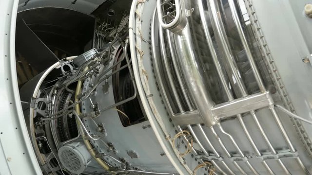 Structure of the aircraft engine with lots of pipes, pumps, compressors, gears, pulleys, blades, valves, hydraulic and servo drives and other elements.
