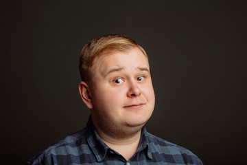 confident caucasian fat man looking at camera