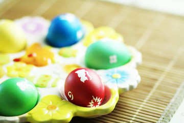 Fototapeta na wymiar Colorful easter eggs on the table background