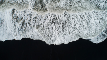 The black sand beach in Iceland. Aerial view and top view. Beautiful natural backdrop.