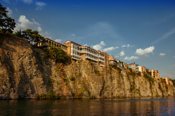Houses on the edge of a cliff above the river Kura. Tbilisi, the historic city center..