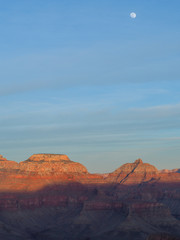 Grand canyon at sunset with moon and shadows