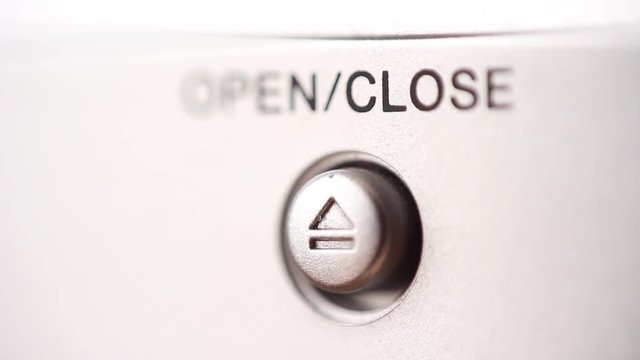 Pressing Open/Close button. Extreme close up
