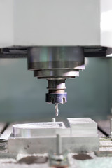 High precision CNC machining center working, operator machining automotive sample part process