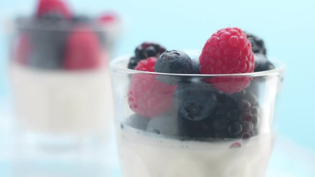 turning glasses with greek yogurt with berries Minimalism food video