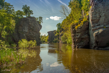 Fototapeta na wymiar Terrific view of the River Canyon on a sunny day. Buky Canyon on the Hirs'kyi Takich river in Ukraine