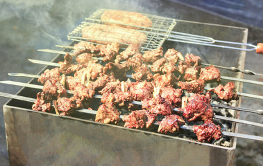 The most delicious sausages, appetizing shish kebab from fresh meat shish kebab , grilled from charcoal, outdoors
