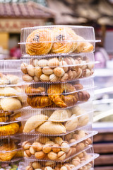Miscellaneous cookies are in plastic boxes.