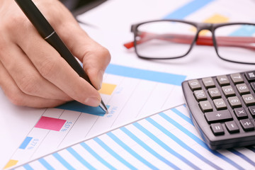 Man working with documents at table. Forex concept