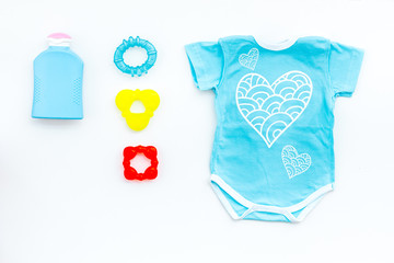 Clothes and accessories for newborn and small children on white background top view