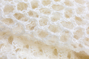 background of crocheted shawl in white mohair and silk wool