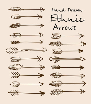 Set of ethnic arrows hand-drawn on a beige background for your design.