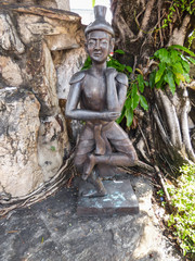 Fototapeta na wymiar Bangkok, Thailand - Circa January 2018: Reusi Dat Ton (Thai Yoga) statue at famous Wat Pho (Buddhist Temple)