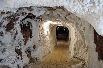 Salt cave in an old mine with white natural stalactites. Cardona’s Salt Mountain Cultural Park....