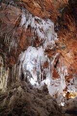 Fototapeta na wymiar Salt cave in an old mine with white natural stalactites. Cardona’s Salt Mountain Cultural Park. Cardona, Spain.