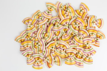 heap of multicolored raw pasta farfalle