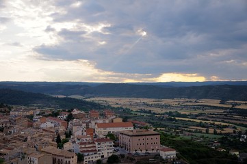 The sky is clouded over. The ray of the sun breaks through the cloud. View from Cardona Castle. Summer. Catalonia, Spain.