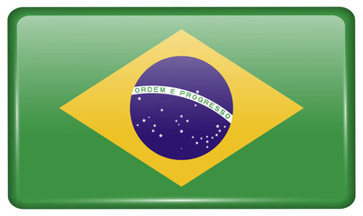 Fototapeta premium Flags Brazil in the form of a magnet on refrigerator with reflections light.