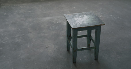 old stool in empty room during renovation