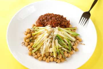 Boiled chickpeas,marinated chilli tofu and onion shoots.