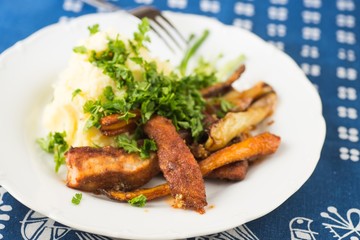 Spicy roasted fish and vegetable, mashed potato.