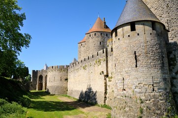 Fototapeta na wymiar Strong walls and towers protecting the medieval town of Carcassonne, Languedoc-Roussillon, France.