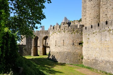 Fototapeta na wymiar Strong walls and towers protecting the medieval town of Carcassonne, Languedoc-Roussillon, France.