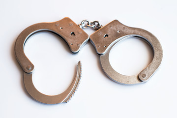 Open cufflinks close-up as a symbol of release from the responsibility of criminals and the...