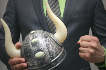 Bull stock broker. Bull market concept. Agressive business strategy. Business man holding a toy...