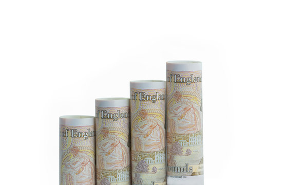 Growing bar graph from GBP British pound banknotes, isolated on white - Powered by Adobe