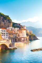 Morning view of Amalfi cityscape on coast line of mediterranean sea, Italy